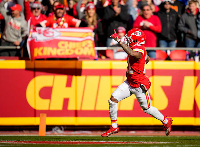 Dec 12, 2021; Kansas City, Missouri, USA; Kansas City Chiefs cornerback Mike Hughes (21) returns a fumble for a touchdown during the first quarter against the Las Vegas Raiders at GEHA Field at Arrowhead Stadium. Mandatory Credit: Jay Biggerstaff-USA TODAY Sports